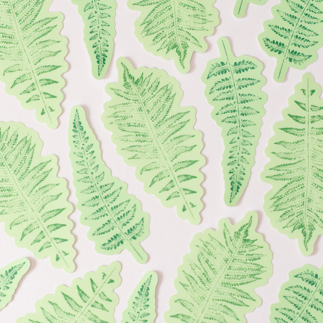 Pattern of two kinds of fern green leaf stickers on a white background