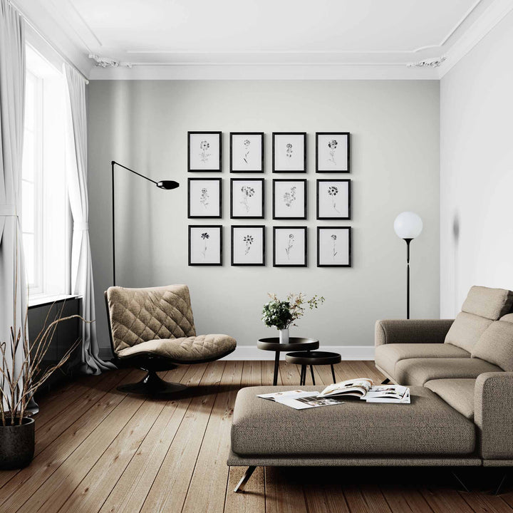 black and white floral gallery wall in living room